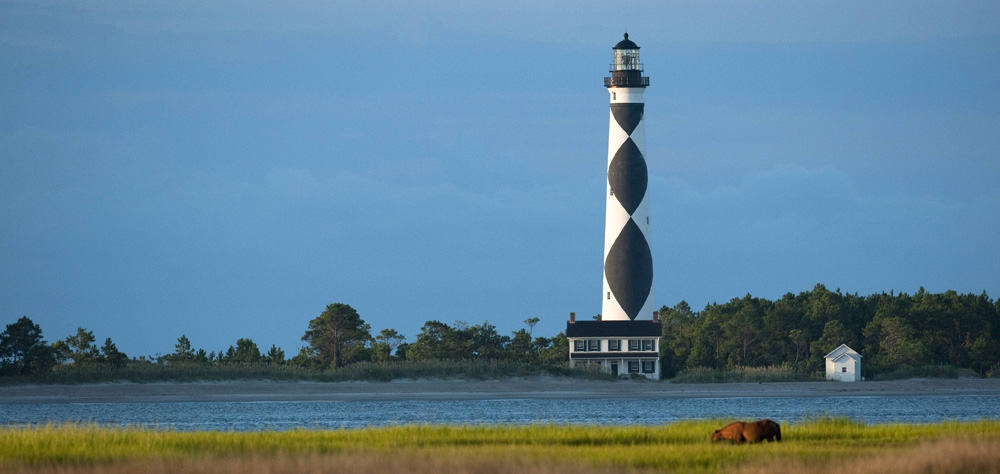 The Cape Lookout Lighthouse (known as Diamond Lady due to the diamond pattern on the exterior) has watched the area for over a century.